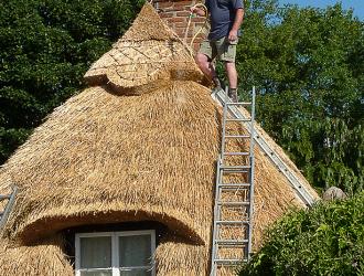 Brook Cottage being re-thatched